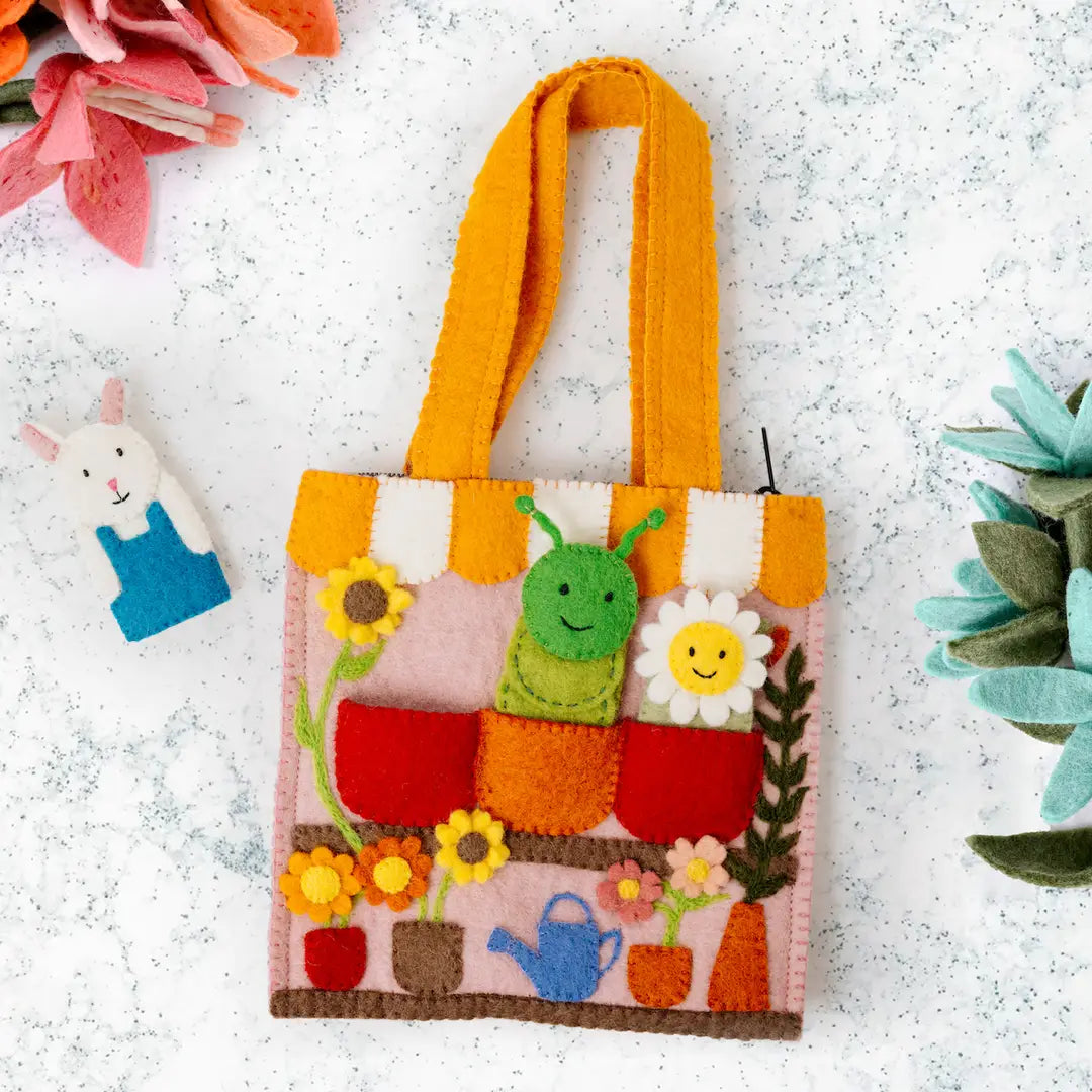 Colorful felt flower shop themed puppet bag with bunny, caterpillar and sunflower finger puppets