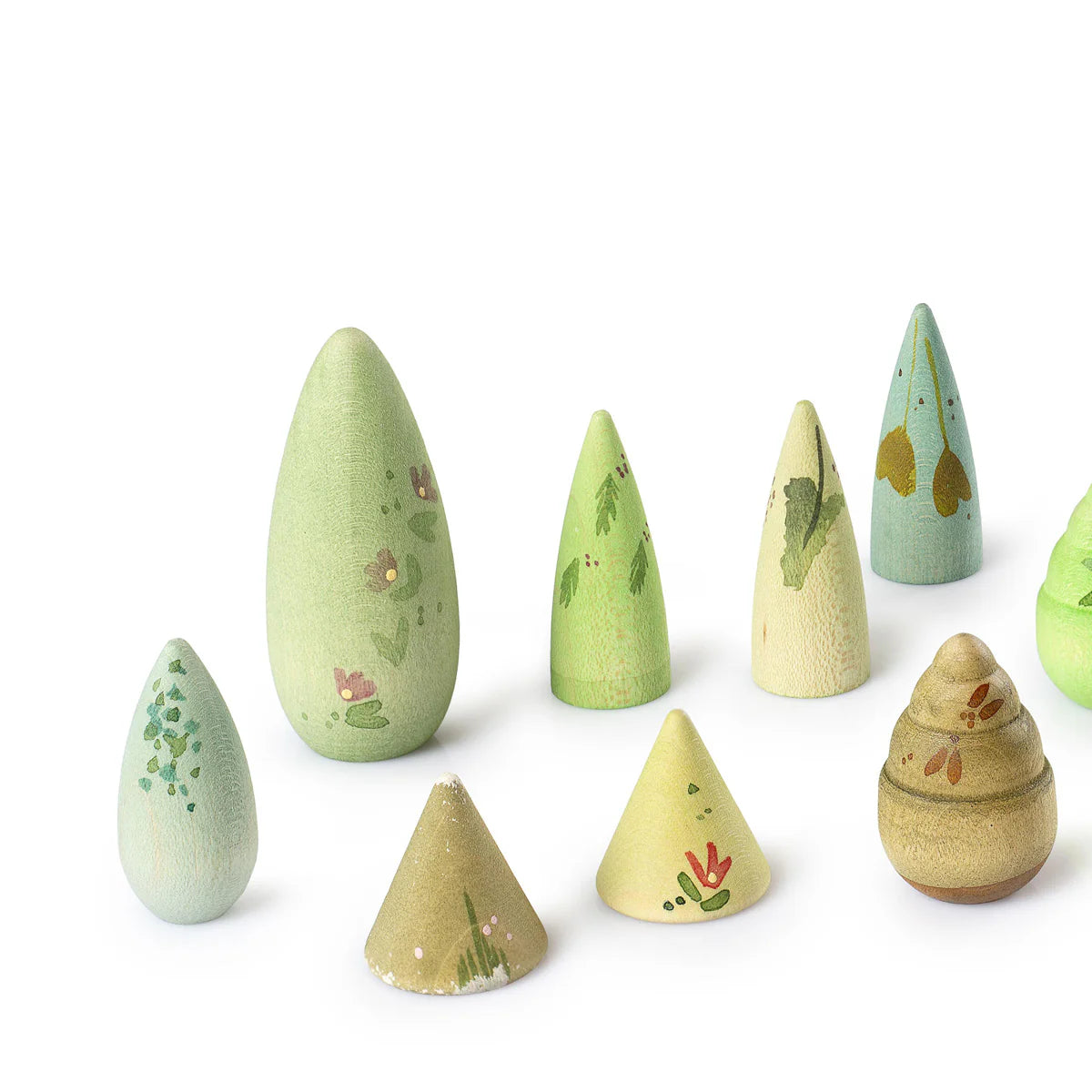 closeup of 8 Grapat hand painted wooden toy trees