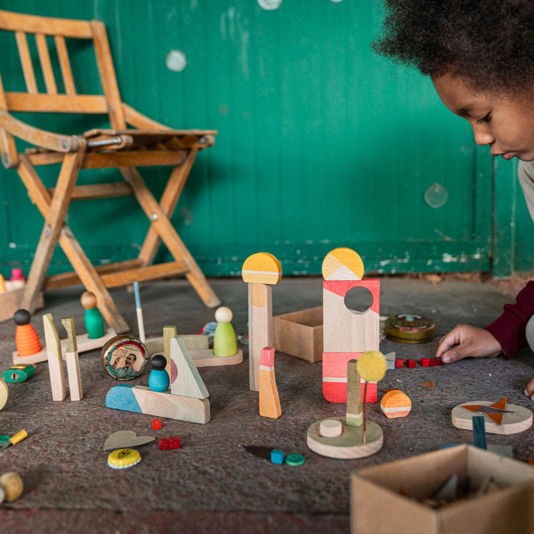 grapat boy with wooden happy place building loose parts set