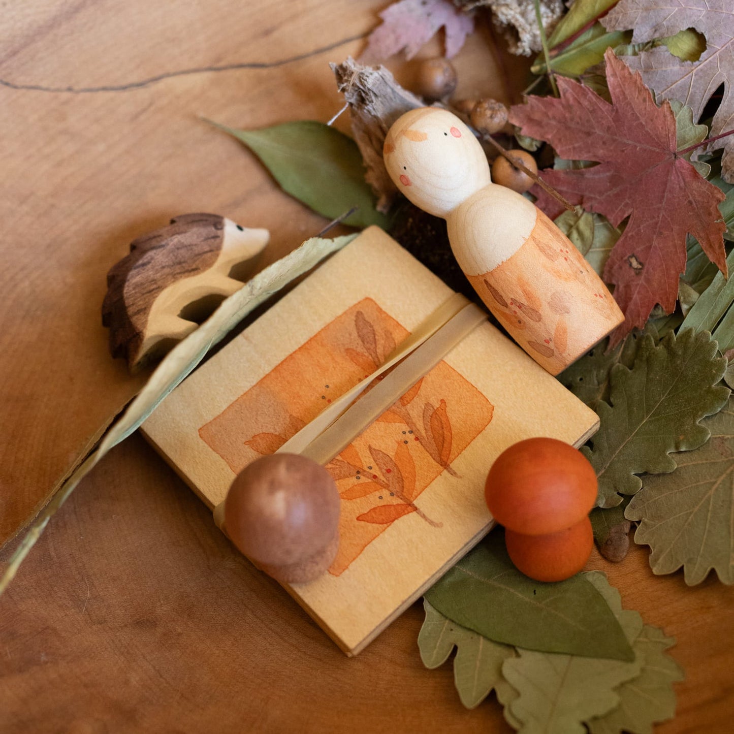 grapat ostheimer hello autumn wooden toy set with nin peg doll, mushrooms, flower press, and hedgehog