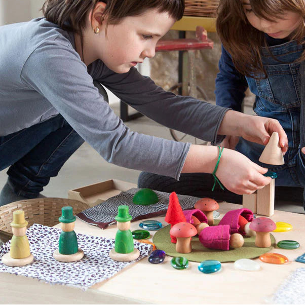 kids playing with grapat wooden nins of the woods gnomes and mushrooms play set