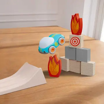Haba toy car jumping over fire blocks