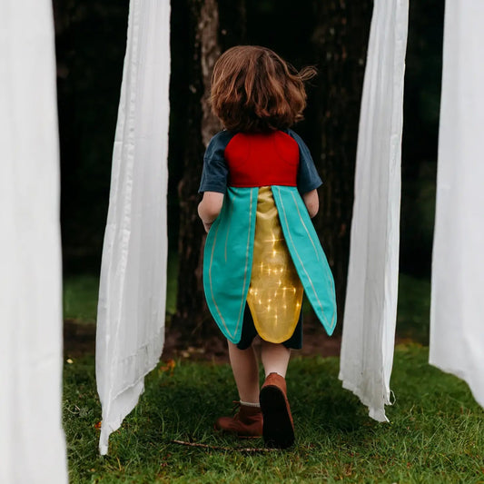 a child in light-up firefly costume wings