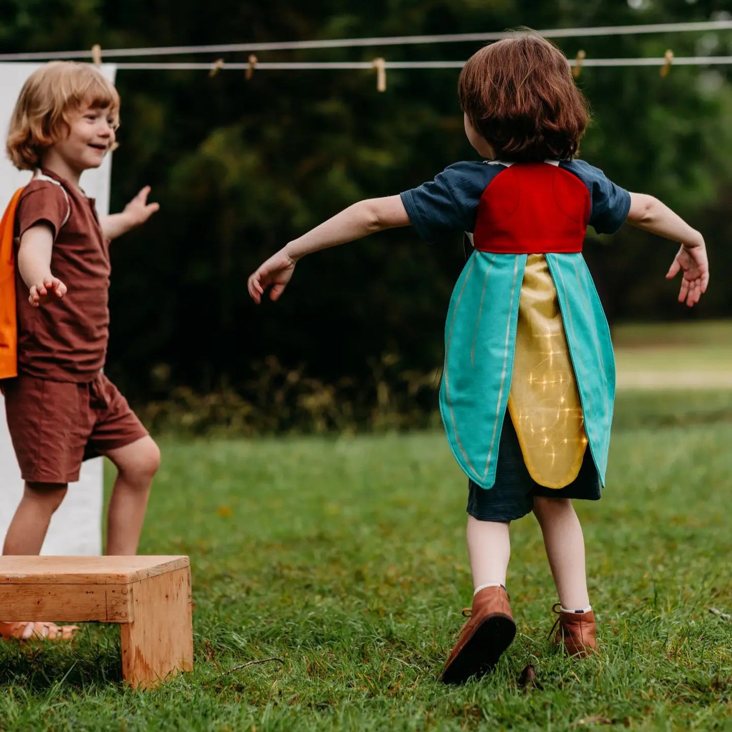 a child in glowing firefly costume wings