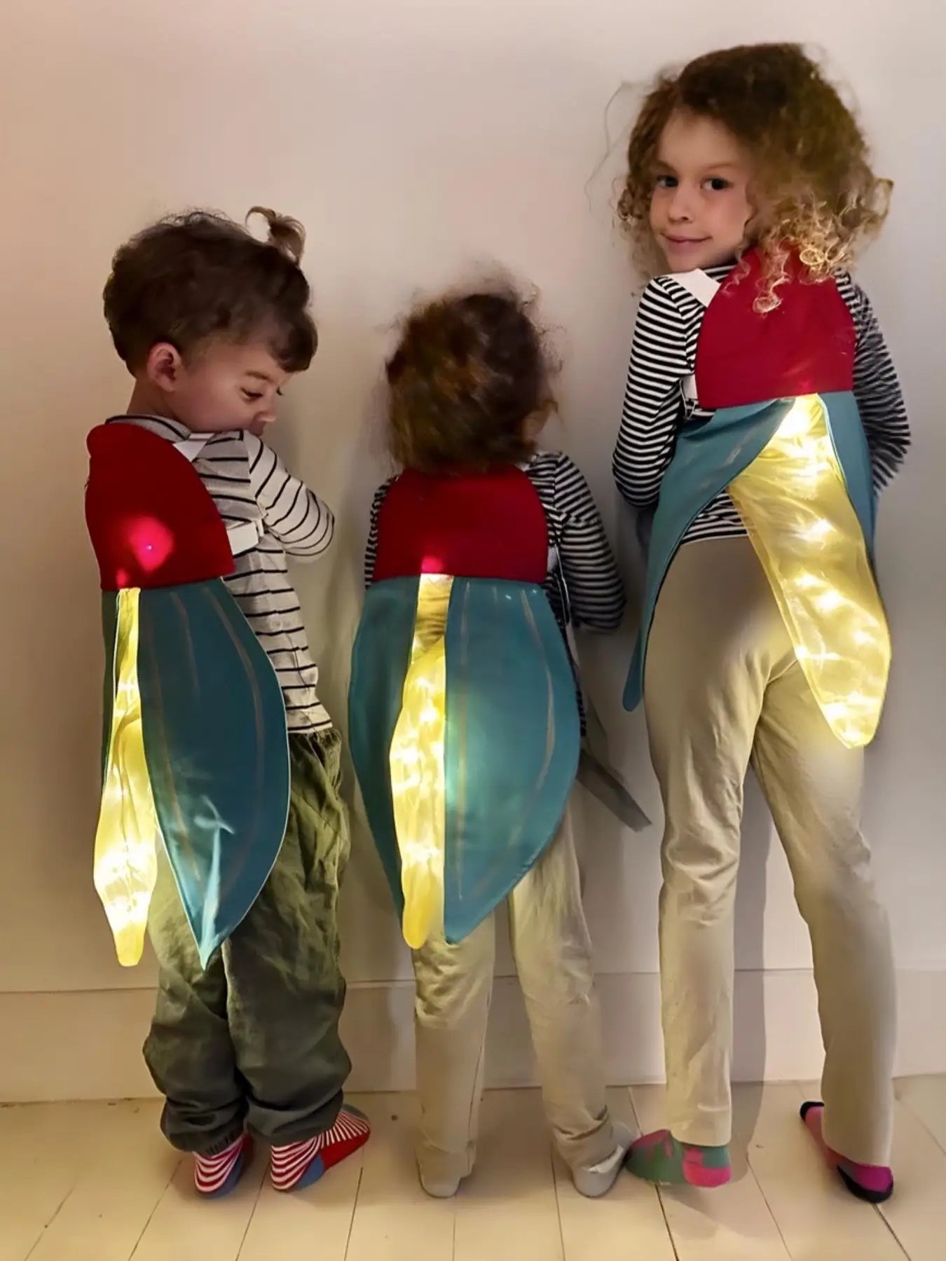 boys and girls in glowing light-up firefly costume wings