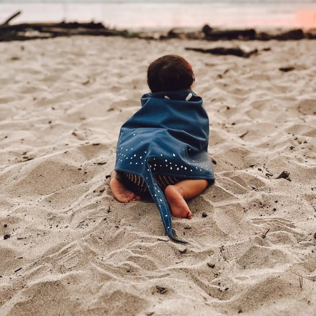 boy on the beach in a handmade blue stingray costume