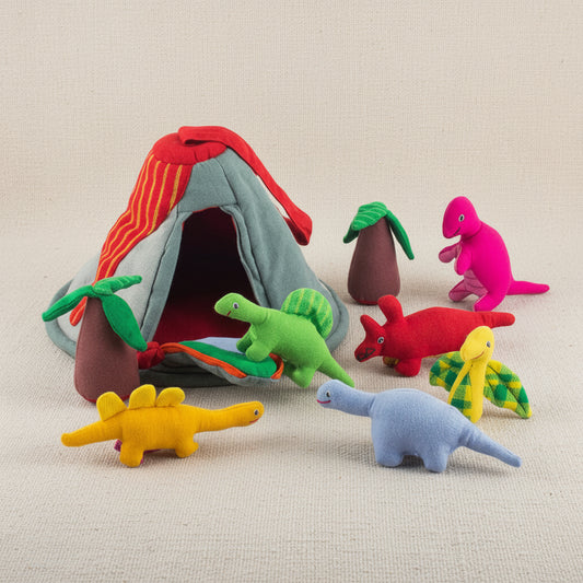 Cotton dinosaur and tree toys with a volcano house