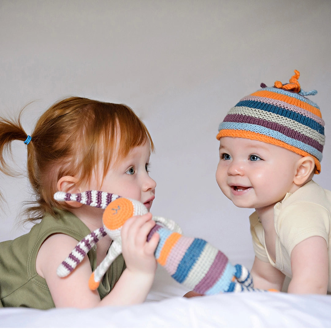 kids sharing rainbow organic crochet bunny