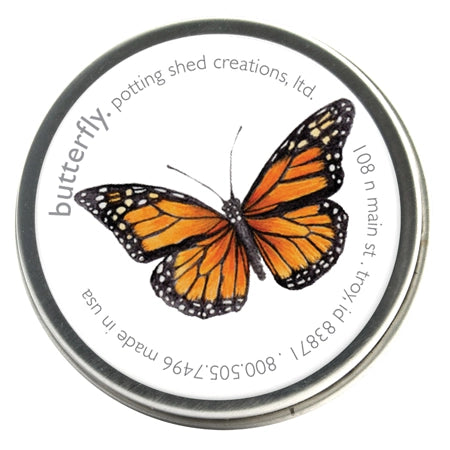Tin container of butterfly garden seed with an illustrated monarch label