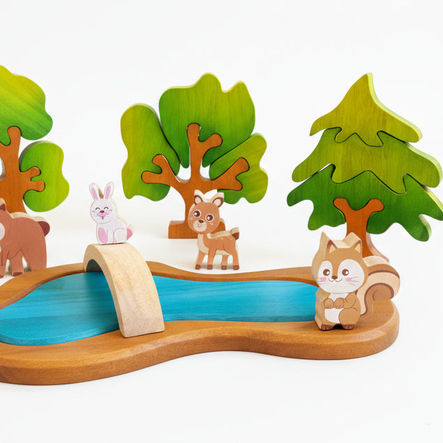 Wooden toy set with animalstrees and a bridge over a river 