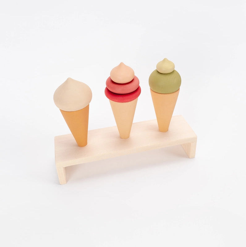 Sabo Concept three wooden play food ice cream cones on a natural wooden display stand.