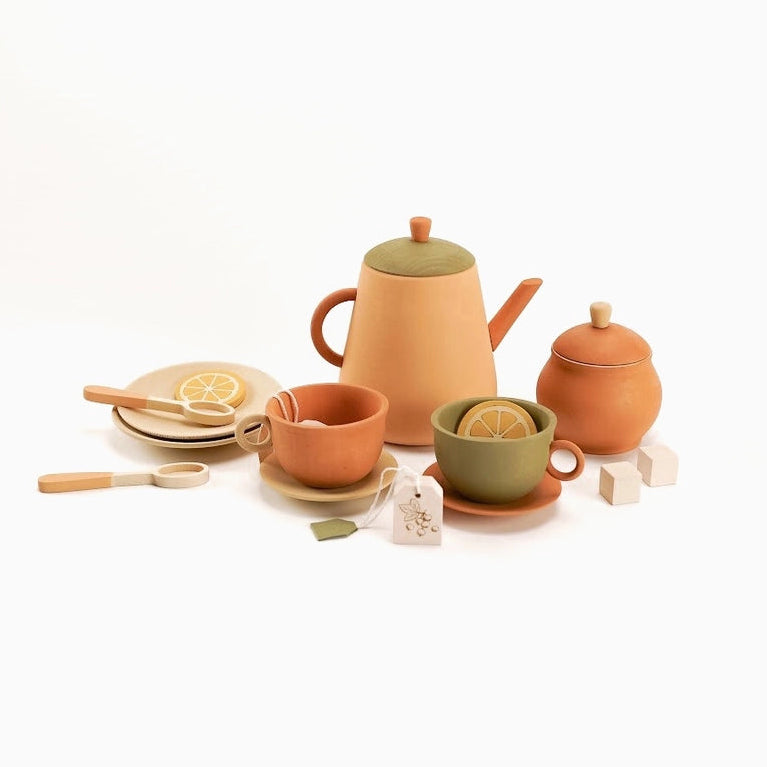 children's wooden tea set toys with a teapot, teacup, sugar bowl, plates, tea bags, spoons, and lemon slices