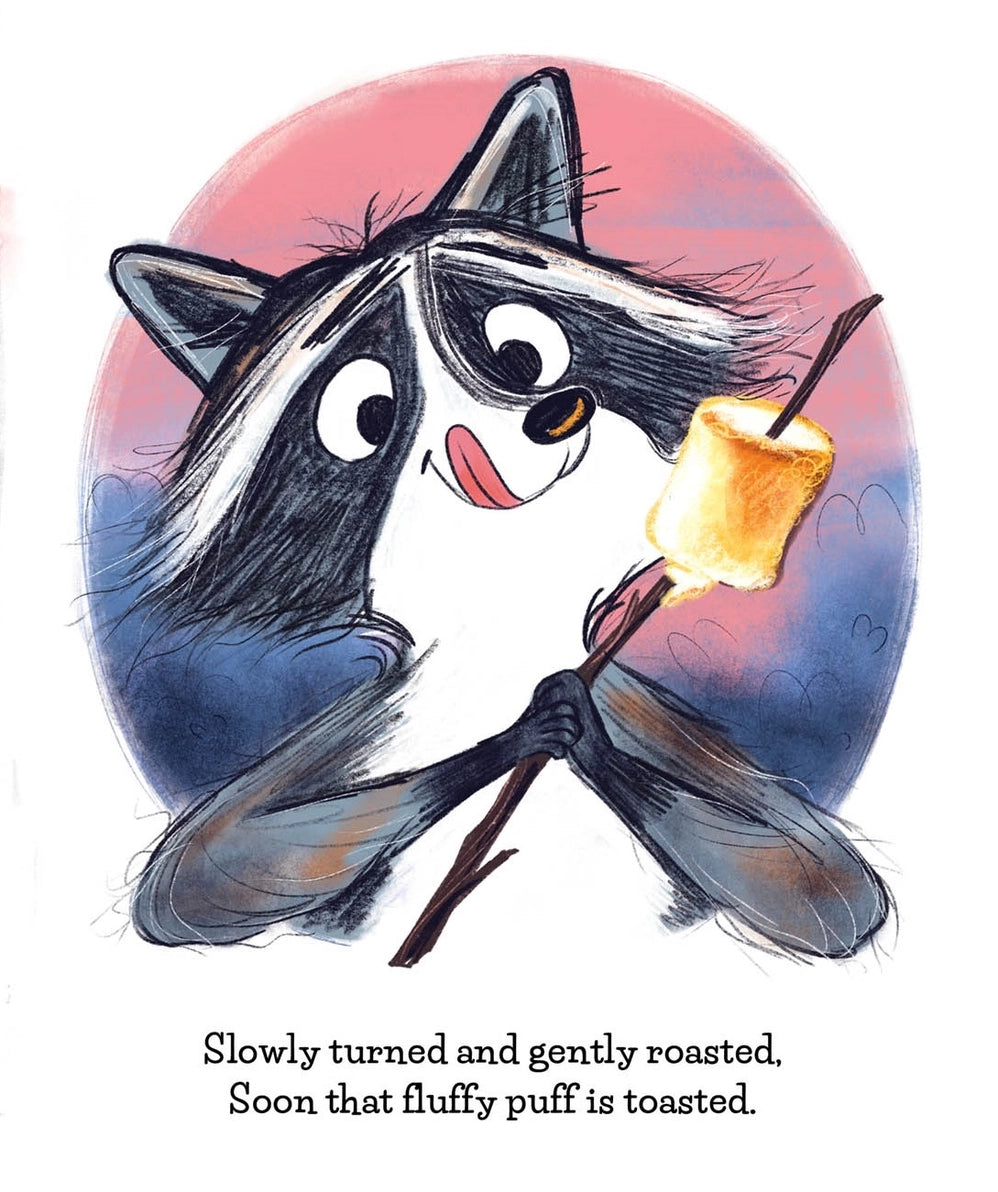Make More S'mores children's book illustration shows a raccoon holding a marshmallow on a stick, with printed text reading, 'Slowly turned and gently roasted. Soon that fluffy puff is toasted.