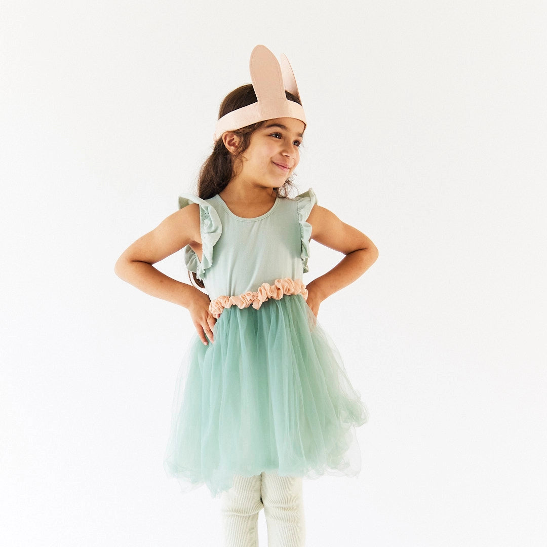 Young girl wearing Sarah's Silks Bunny ears and tail costume accessories