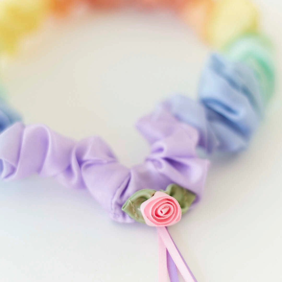 Sarah's Silks soft rainbow garland with a rosebud decoration
