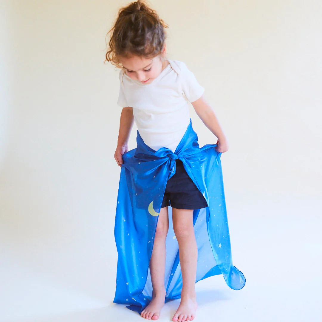 girl wearing Sarah's Silks starry night playsilk as a skirt