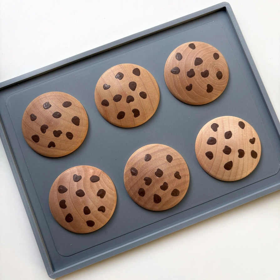 hand painted wooden play food chocolate chip cookies on a baking tray