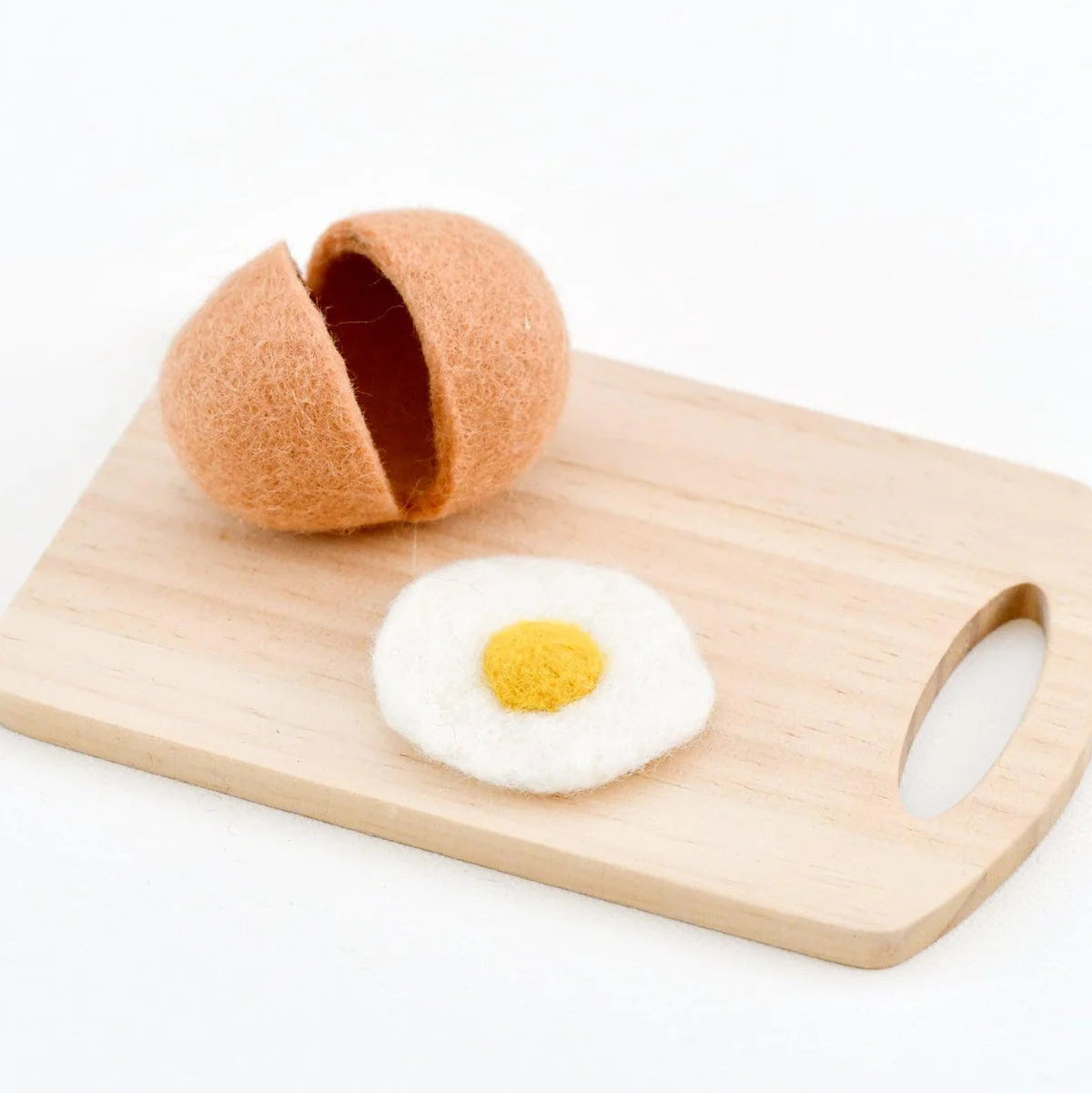 Tara Treasures felt play food eggshell cracked open with a felted egg toy