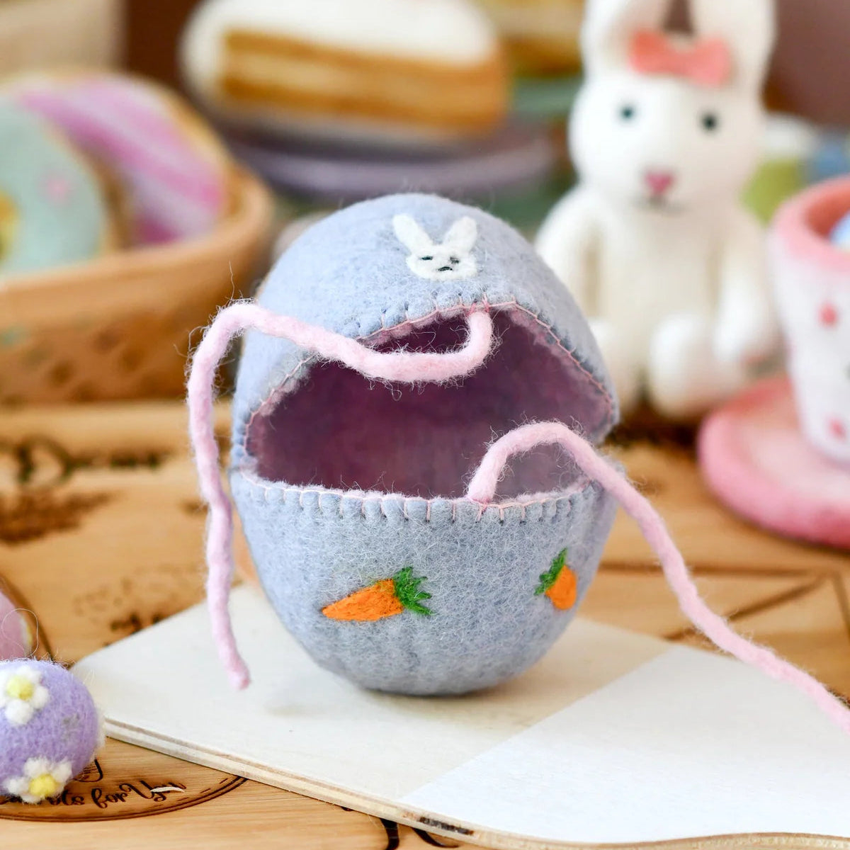Tara Treasures felt Easter egg cover with a bunny and carrots design