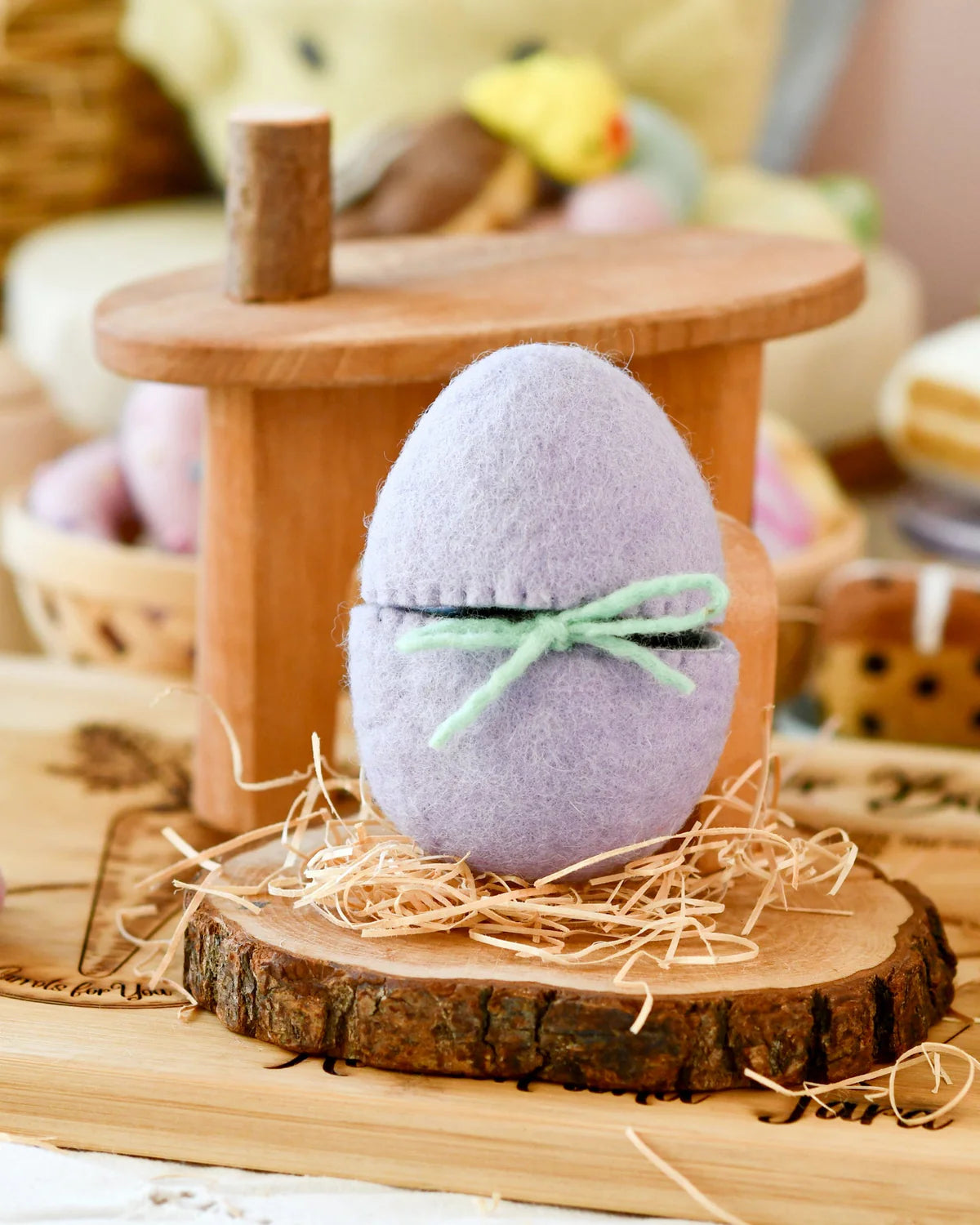 Tara Treasures felt purple surprise egg with  a green bow