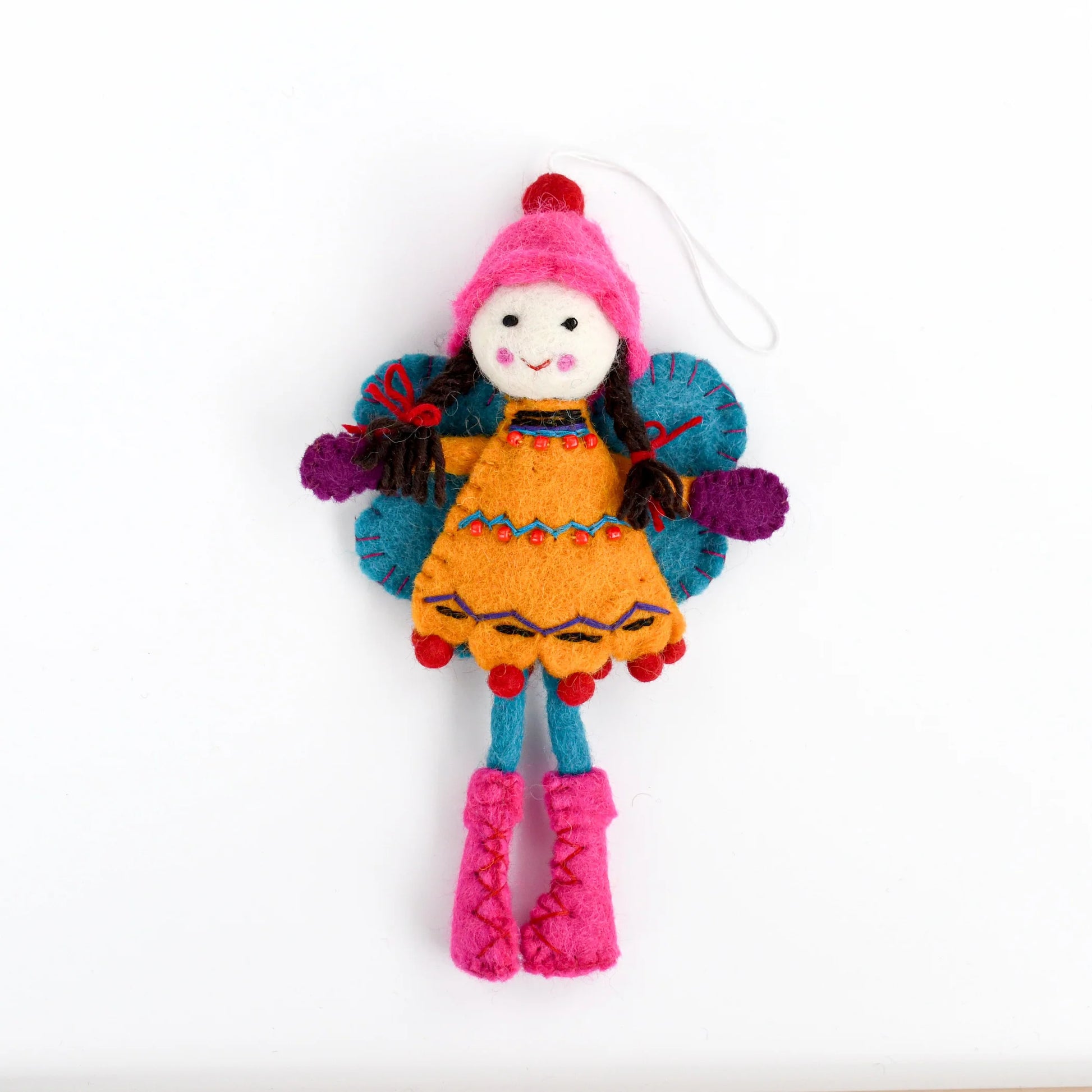 Colorful felted fairy doll with a pink hat and orange dress and blue wings