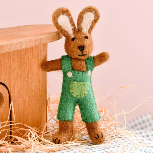 Tara Treasures felt toy rabbit wearing green overalls.