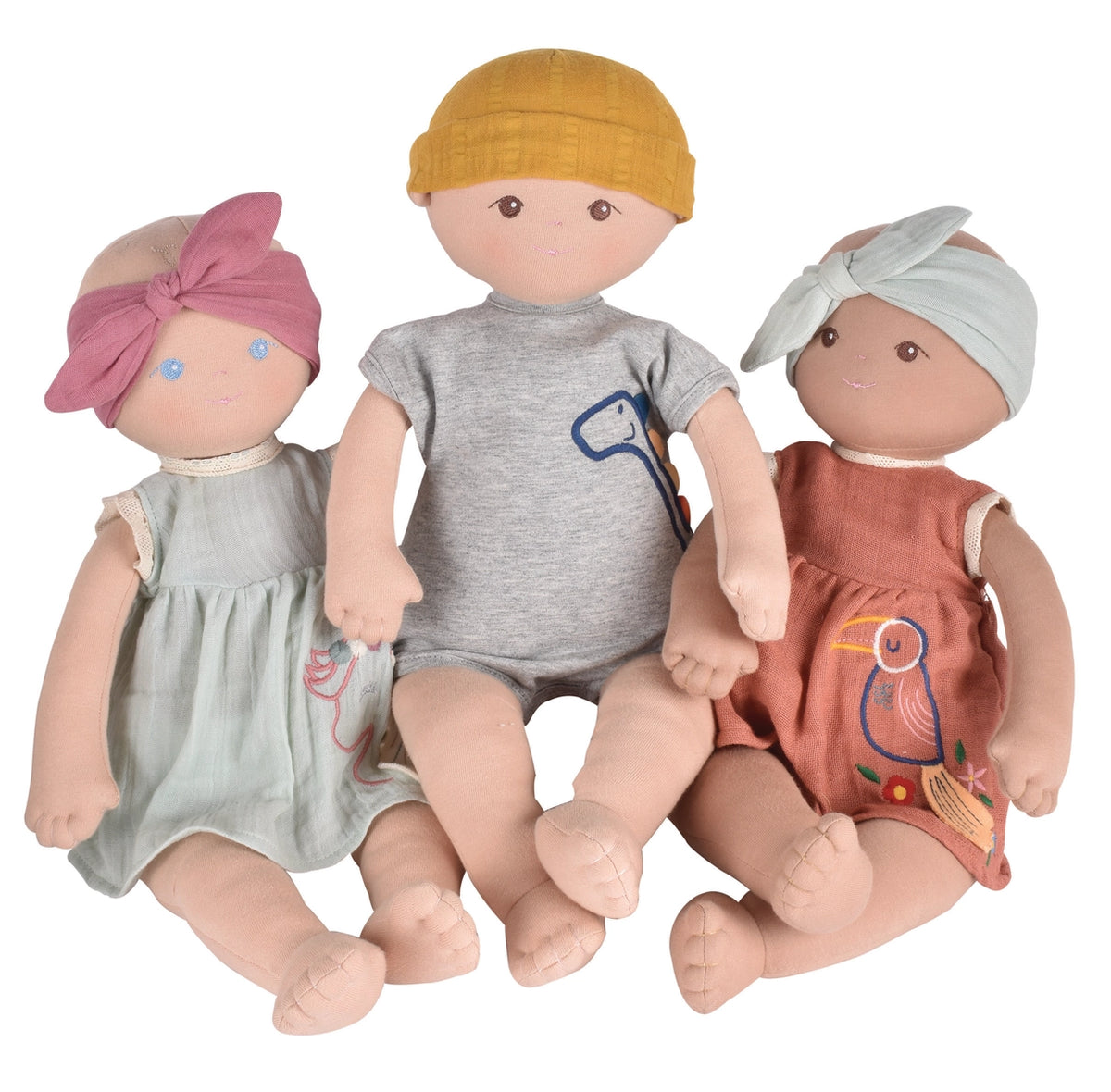 One baby boy doll and two baby girl dolls made of organic cotton