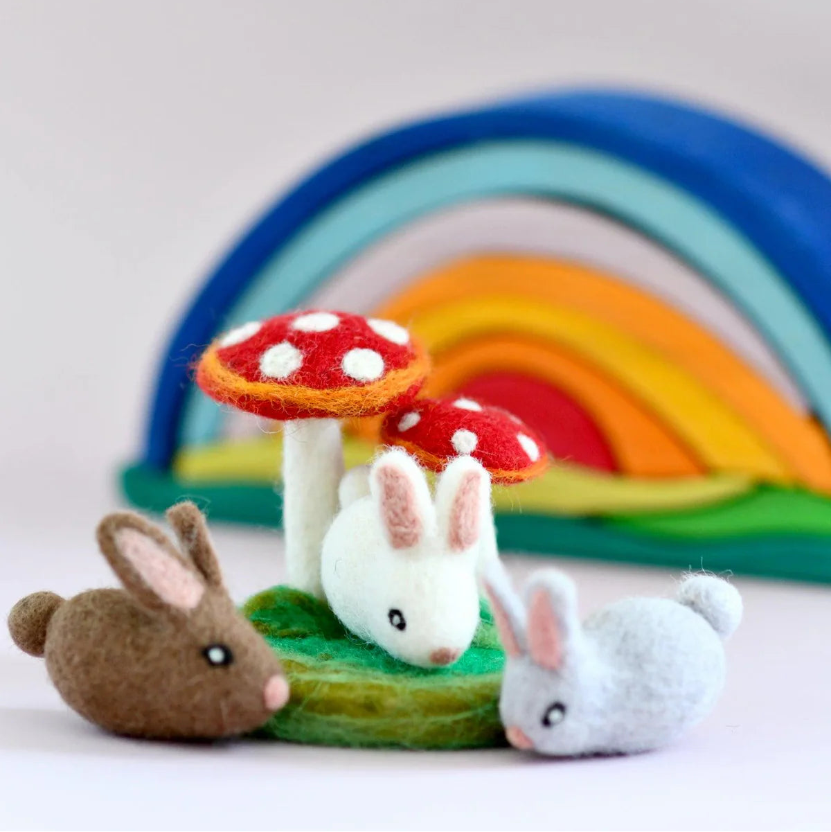 Tara Treasures felt bunny rabbits under red mushroom toadstools