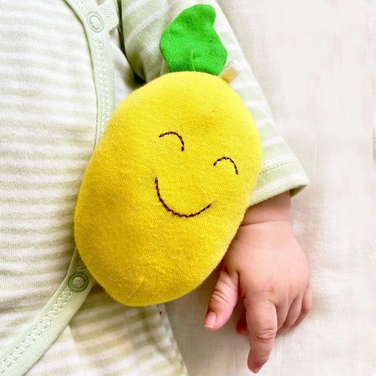 baby holding under the nile organic lemon toy
