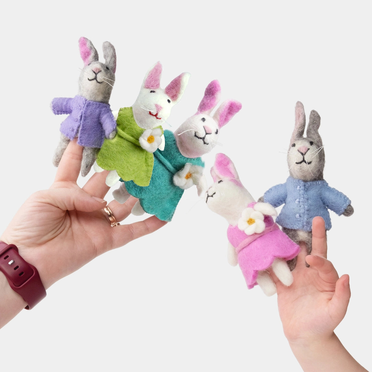 Felt peter rabbit finger puppets in colorful clothing 
