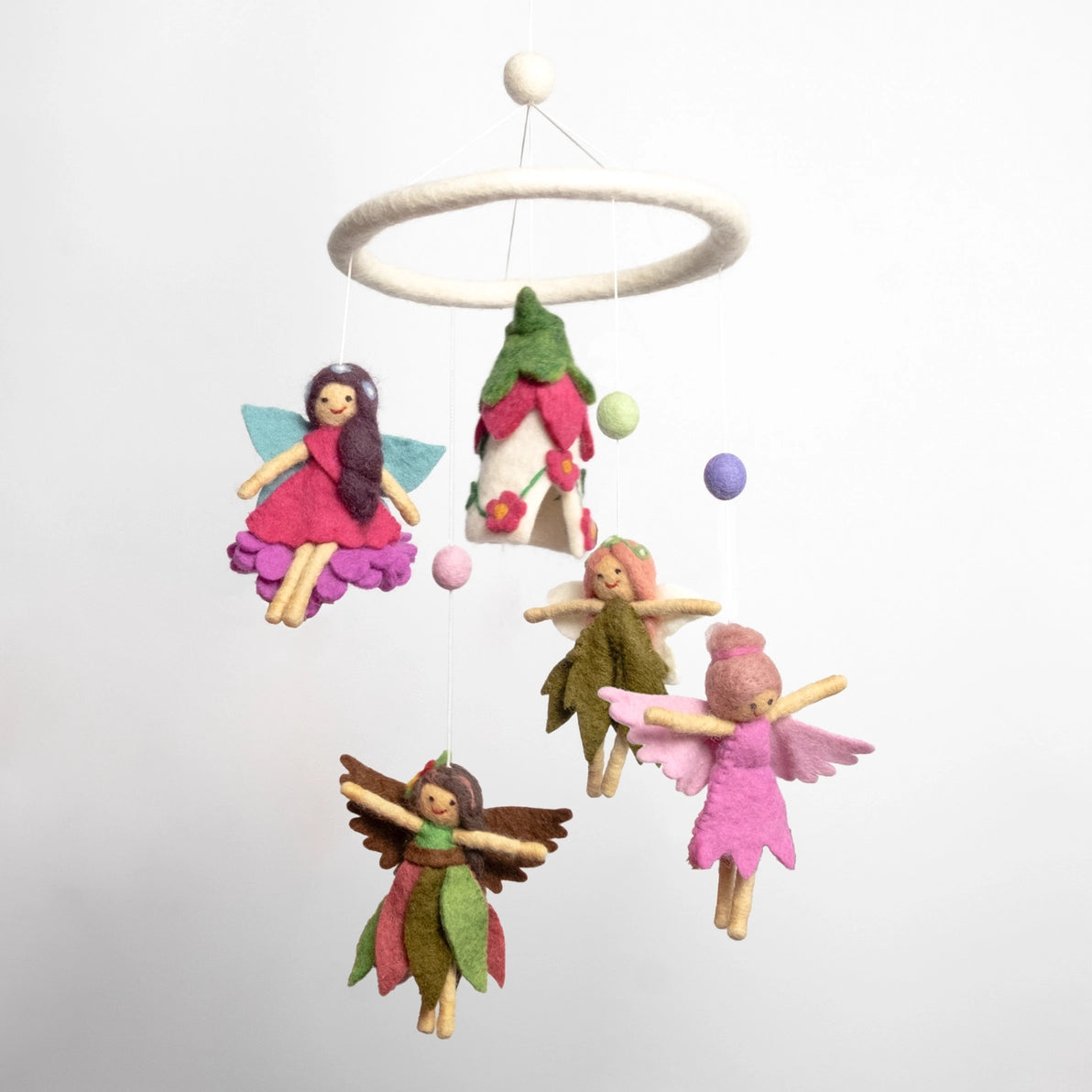 Fairy-themed baby mobile with colorful fairies and a fairy house 