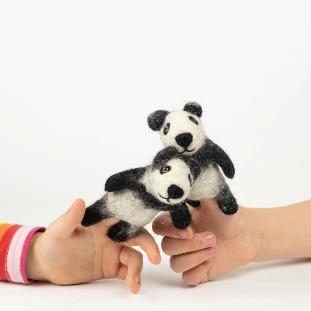 Kids playing with Winding Road felt panda finger puppets