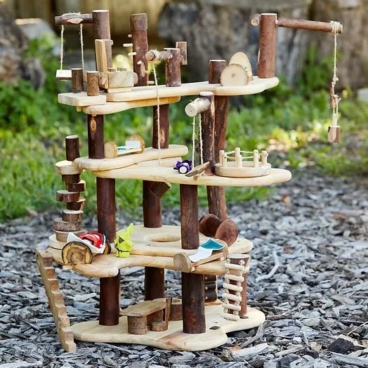 wooden toy treehouse and gnomes outside